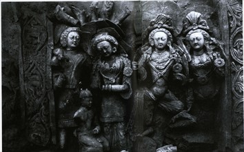 Two couples of a legend scene, clay relief