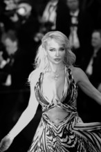 A guest attends the "Histoires De La Nuit" (The Birthday Party) screening during the 79th annual