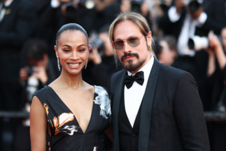 Zoe Saldaña (in Chanel) and Marco Perego attend the closing ceremony of the 79th annual Cannes Film