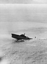 The Japanese light cruiser "Kashii" sinking, January 12, 1945.
