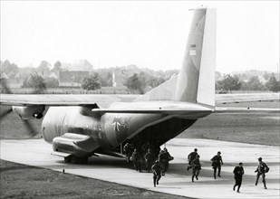 Soldiers disembarking from a C-160 Transall