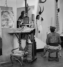 Dali and Gala pose in his studio at Port Lligat
