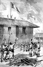 Dahomey. The French flag is raised over the palace of King Behanzin in Abomey