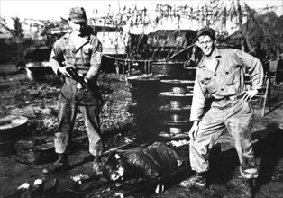 Two American soldiers manhandling a prisoner. Vietnam.