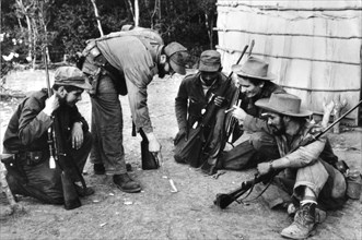 During the revolution, Fidel Castro and Che Guevara surrounded by guerillas (1956-1959)