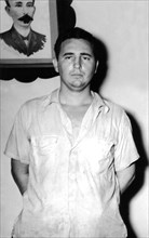 Portrait de Fidel Castro. Derrière lui, le portrait de José Marti (années 50)