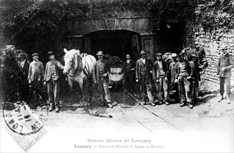 Postcard showing miners entering the mineral basin of Longwy