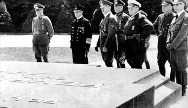 Hitler in front of the 1918 armistice plaque, in Rethondes