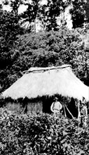 American soldiers in front of a "bandits" hut, just before the hut is set on fire