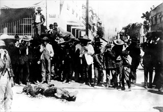 Mexican revolution. A corpse, half burned, that was left in the streets of Mexico for more than eight days