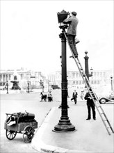 Paris. Installation of security blue lamps on public street lamps.