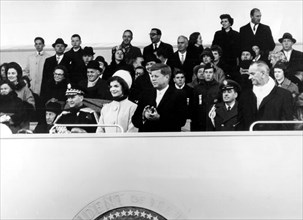 Washington, inaugural parade. In the stand, Kennedy and his wife, and on the r., vice-president Johnson