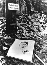After the capture of Cologne by the Allies, portrait of Hitler amid the ruins
