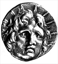 Gold coin representing the sun with the features of Alexander the Great