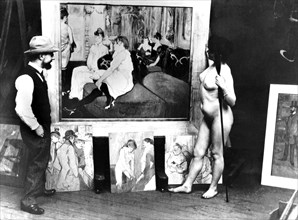 Toulouse-Lautrec, devant sa toile "Au salon de la rue des Moulins", en compagnie de son modèle