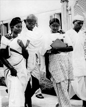 Gandhi surrounded by his daughters