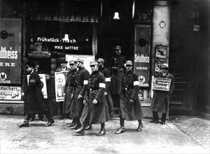 Berlin. Hitlerian Schupos going out of a shop they have just searched