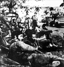 Fidel Castro surrounded by guerillas
