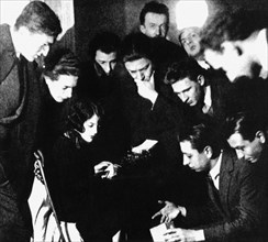 Group of surrealists at Simone Breton's place (Philippe Soupault, 2nd on the left)