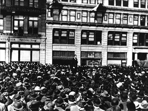 In New York, Carlo Tresca is delivering a speech during a meeting of industry workers at Union Square