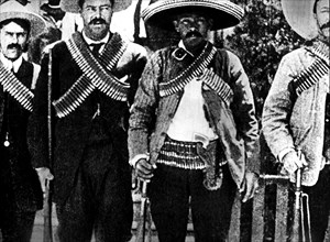 Francisco Villa and his fellow companions, armed to the teeth, during the decisive days of the revolution, in the north of the Republic