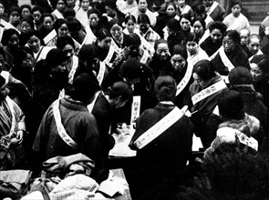 Japanese women voting for the minseito party, whose future victory is the cause of a military putsch