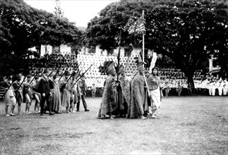 Hawaiians parading with an American flag