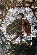 Roman mosaic. Man holding a shield