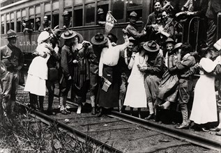 Women saying goodbye to soldiers