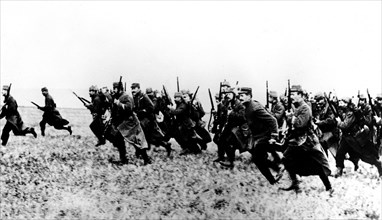 Infantrymen charging with fixed bayonets