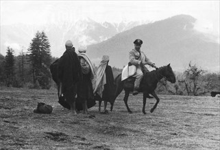 An Uruguayan officer patrolling on horseback along the Kashmir cease-fire line (1955)