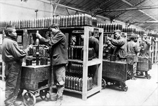 World War I. Anamites working in an armament factory: painting shells