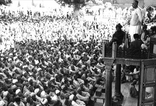 Sheik Mohammed Abdullah leading the prayers from a balcony of the Srinager mosque (1948)