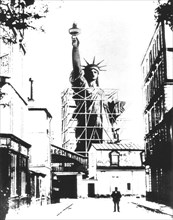 Scale model of the Statue of Liberty created by Bartholdi, photographed in Paris, seen from the Boulevard de Courcelles