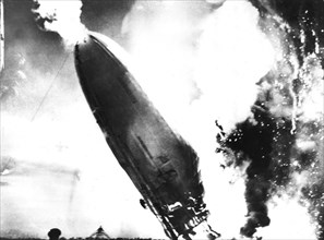 The "Hindenburg" crashes in flames