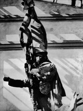 Milan. Mussolini hanging by his heels in Piazza Loretto
