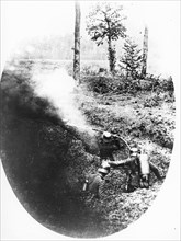 German soldiers firing with a flame thrower