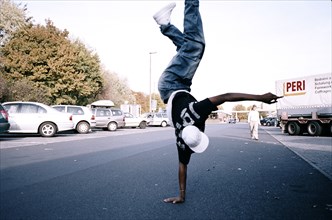 Hip-hop dancer on a car park