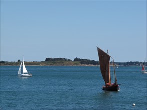 Sailing boats off the coast of the Island de Berder, Brittany (Bretagne)