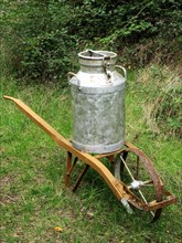 Wheelbarrow and milk churn