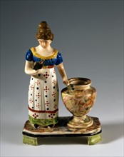 Inkwell with figure of a woman reading