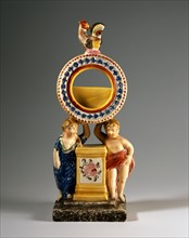 Watch holder with putti and a rooster on the top