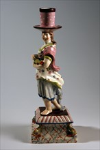 Candlestick in the shape of a woman holding fish