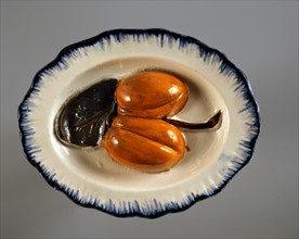 Small ornamental dish with fruit relief