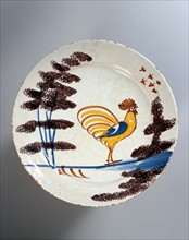 Assiette décorée d'un coq