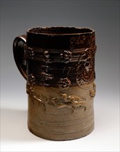 Brown stoneware tankard