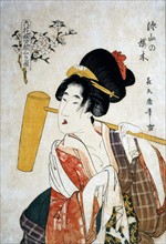 Tsukimaro, Young woman with a wooden hammer over her shoulder