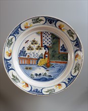 Oriental style plate depicting a geisha indoors