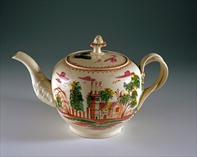 Teapot with painted landscape design