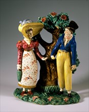 Fireplace match holder depicting a scene of two lovers meeting